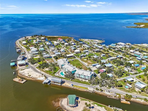 an aerial view of residential building and ocean