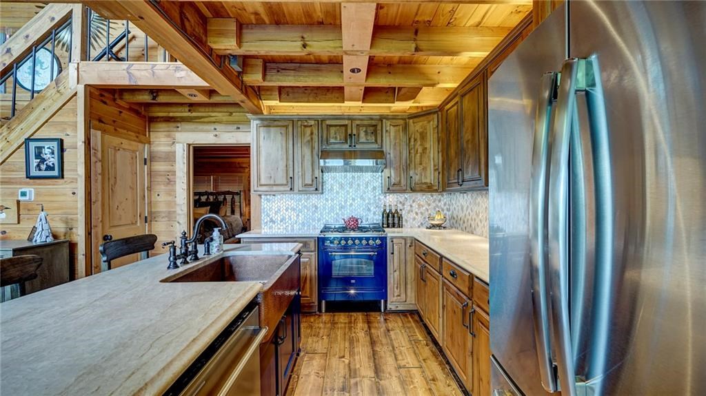 Undisclosed Address Blue Ridge, GA 30513 - Photo 15 of 51 a kitchen with stainless steel appliances granite countertop a sink a stove and refrigerator