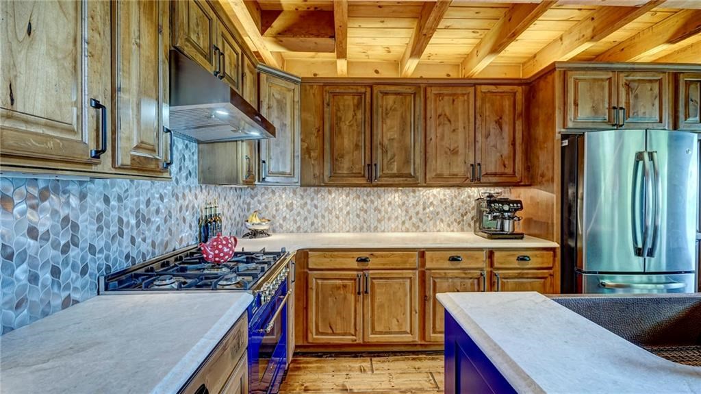 Undisclosed Address Blue Ridge, GA 30513 - Photo 16 of 51 a kitchen with a sink a stove and cabinets