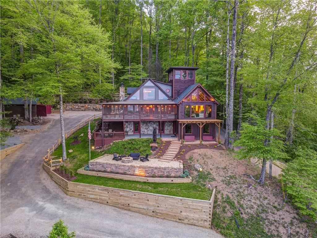Undisclosed Address Blue Ridge, GA 30513 - Photo 2 of 51 front view of a house with a garden