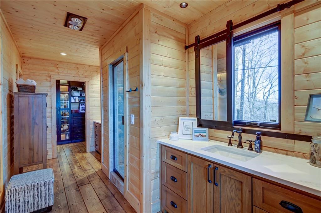 Undisclosed Address Blue Ridge, GA 30513 - Photo 28 of 51 a bathroom with a sink double vanity and a shower