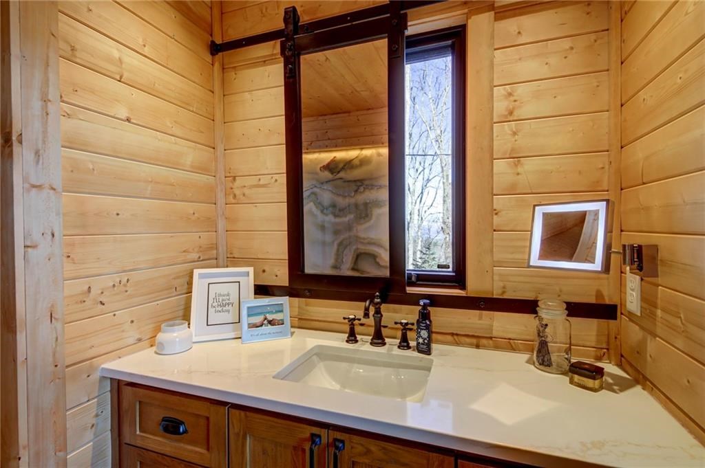 Undisclosed Address Blue Ridge, GA 30513 - Photo 31 of 51 a bathroom with a sink and a mirror