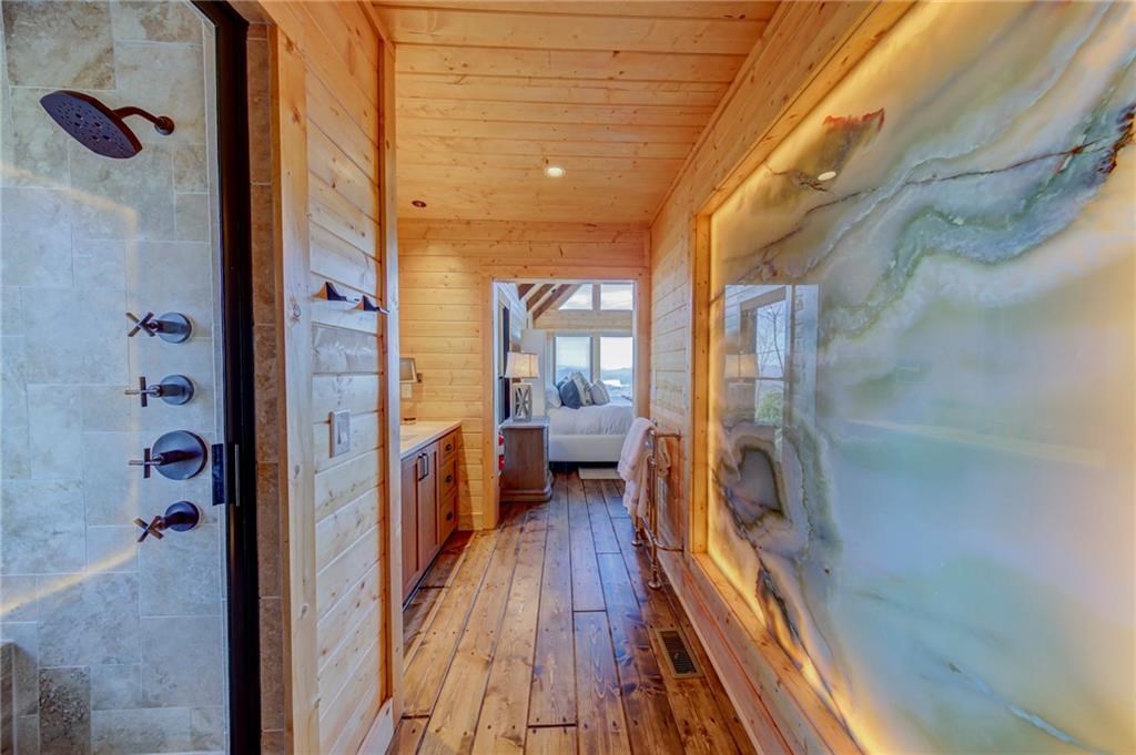 Undisclosed Address Blue Ridge, GA 30513 - Photo 32 of 51 a view of a hallway with a hardwood floor