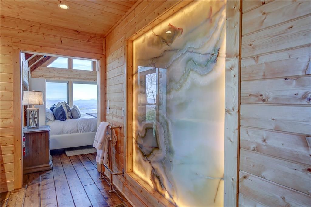 Undisclosed Address Blue Ridge, GA 30513 - Photo 36 of 51 a living room with furniture and a floor to ceiling window