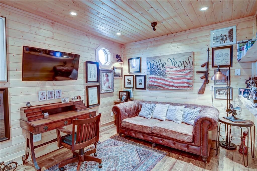 Undisclosed Address Blue Ridge, GA 30513 - Photo 41 of 51 a living room with furniture and a flat screen tv