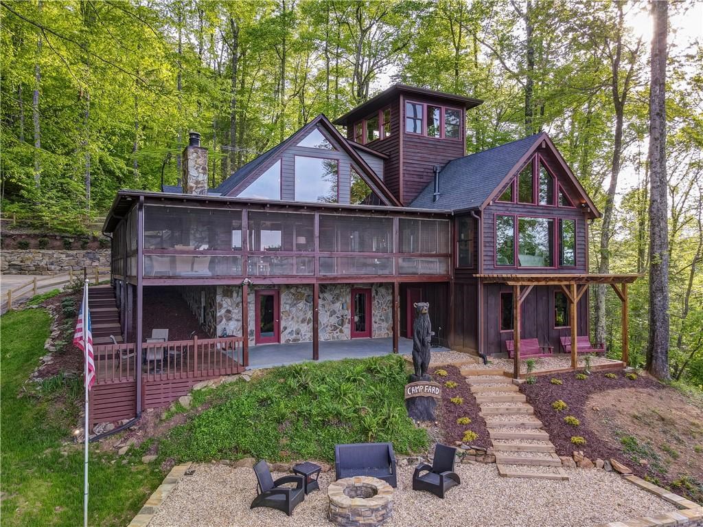 Undisclosed Address Blue Ridge, GA 30513 - Photo 45 of 51 a front view of a house with garden