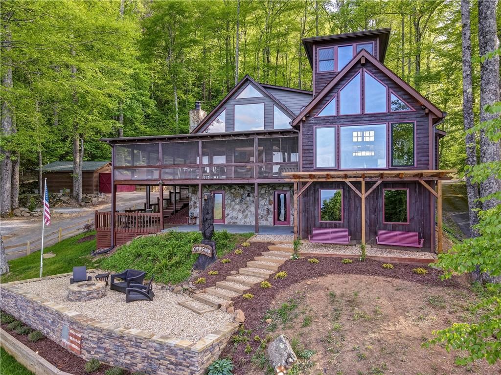 Undisclosed Address Blue Ridge, GA 30513 - Photo 47 of 51 a view of a house with a yard and plants