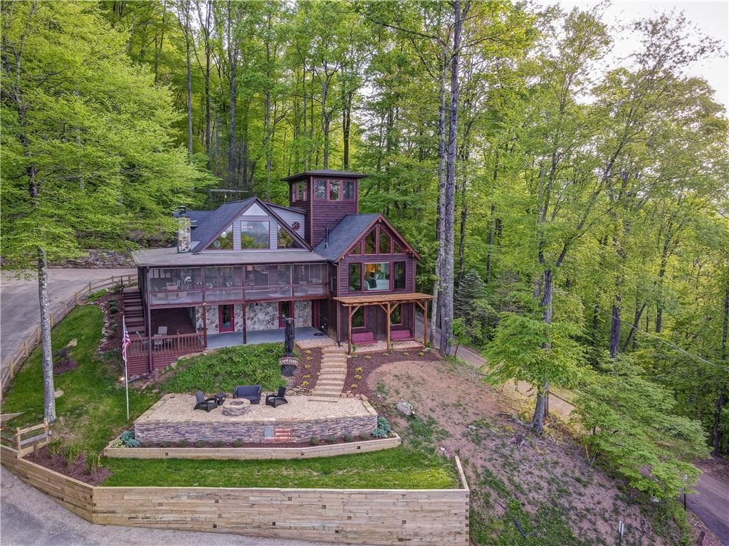 Undisclosed Address Blue Ridge, GA 30513 - Photo 48 of 51 a front view of a house with a garden