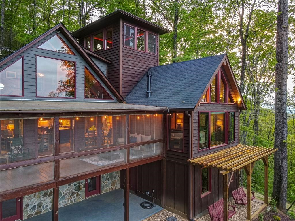 Undisclosed Address Blue Ridge, GA 30513 - Photo 50 of 51 a front view of a house with balcony and iron fence