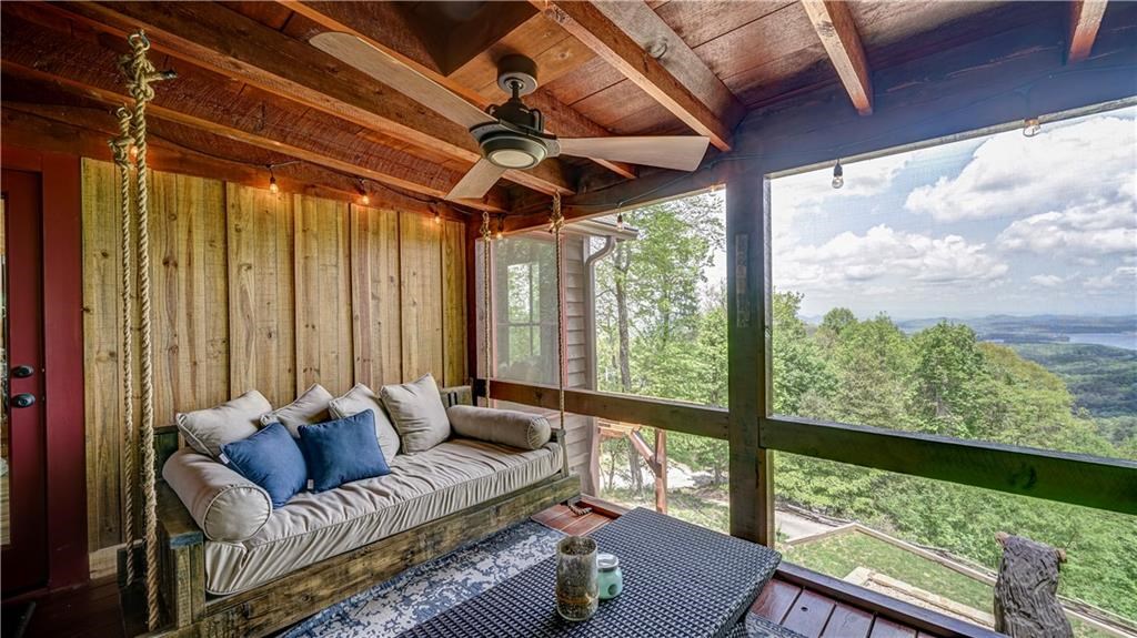 Undisclosed Address Blue Ridge, GA 30513 - Photo 5 of 51 a living room with furniture and a large window