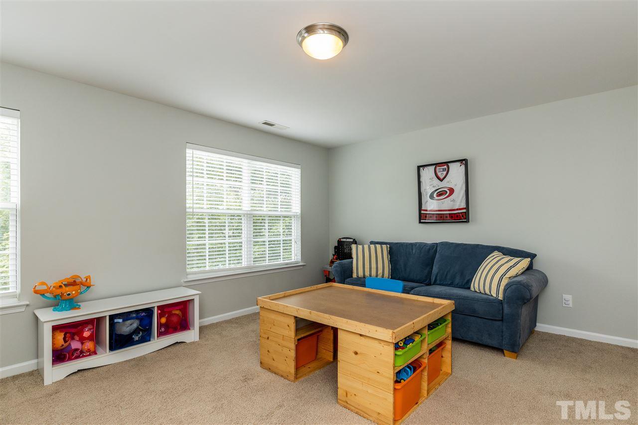 3500 Weir Way Raleigh, NC 27616 - Photo 22 of 28 a living room with furniture and a window