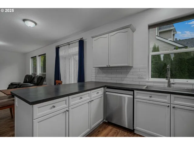 a kitchen with a sink and cabinets