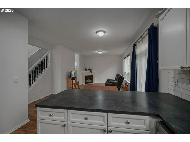 a kitchen with kitchen island sink and faucet