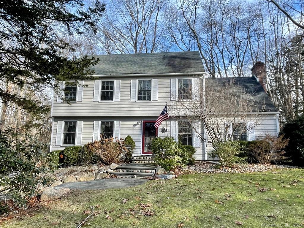84 Fairy Dell Road Clinton, CT 06413 - Photo 1 of 39 a front view of house with yard and trees around