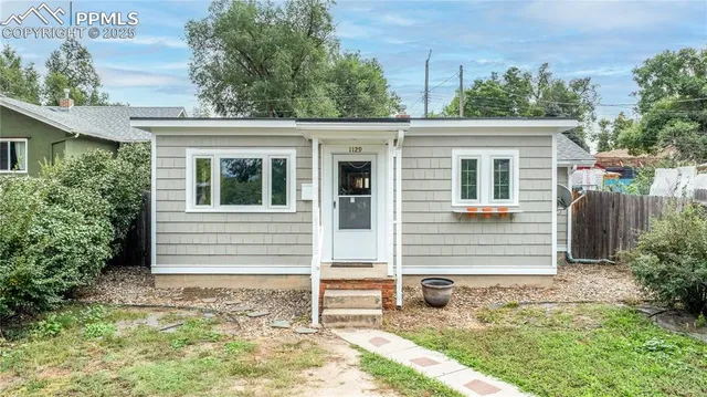 front view of a house with a yard