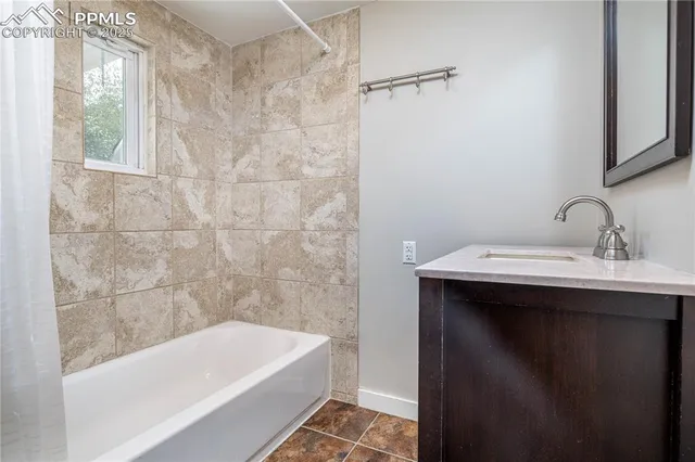 an empty room with closet and a hallway