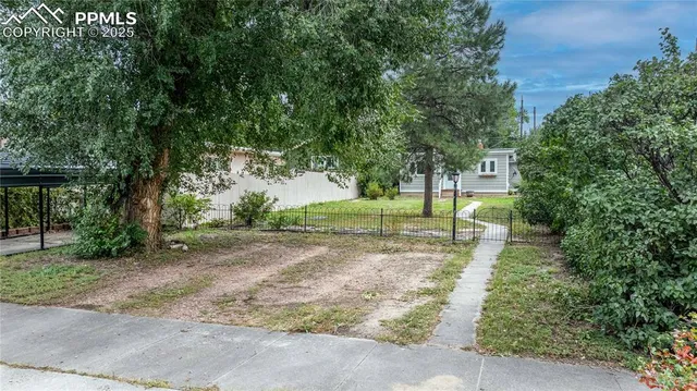 an aerial view of houses with outdoor space