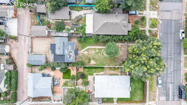 front view of a brick house with a yard