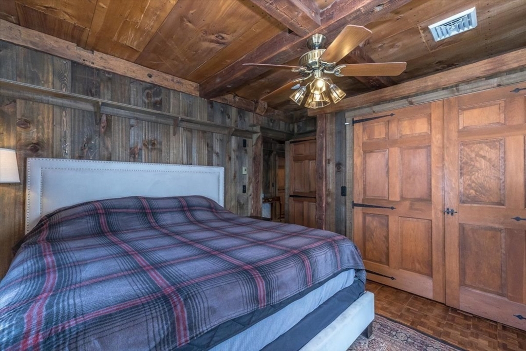 1083 Mt Elam Road Leominster, MA 01420 - Photo 11 of 30 a bedroom with a bed and a chandelier