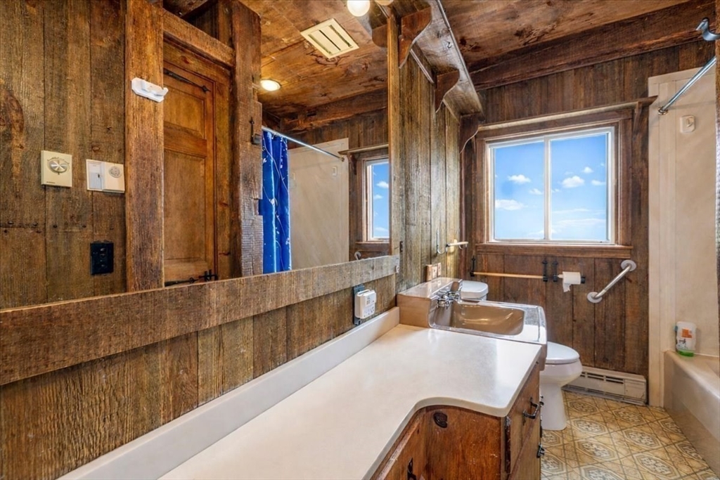 1083 Mt Elam Road Leominster, MA 01420 - Photo 12 of 30 a bathroom with a tub and a mirror