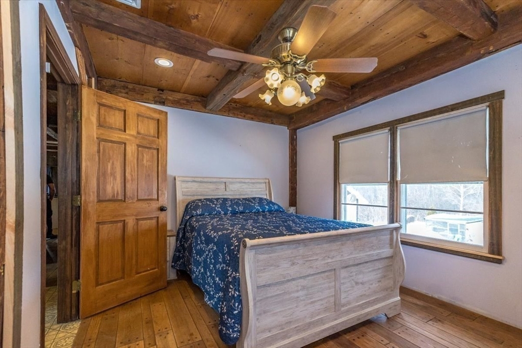 1083 Mt Elam Road Leominster, MA 01420 - Photo 14 of 30 a bedroom with a large bed and a large window