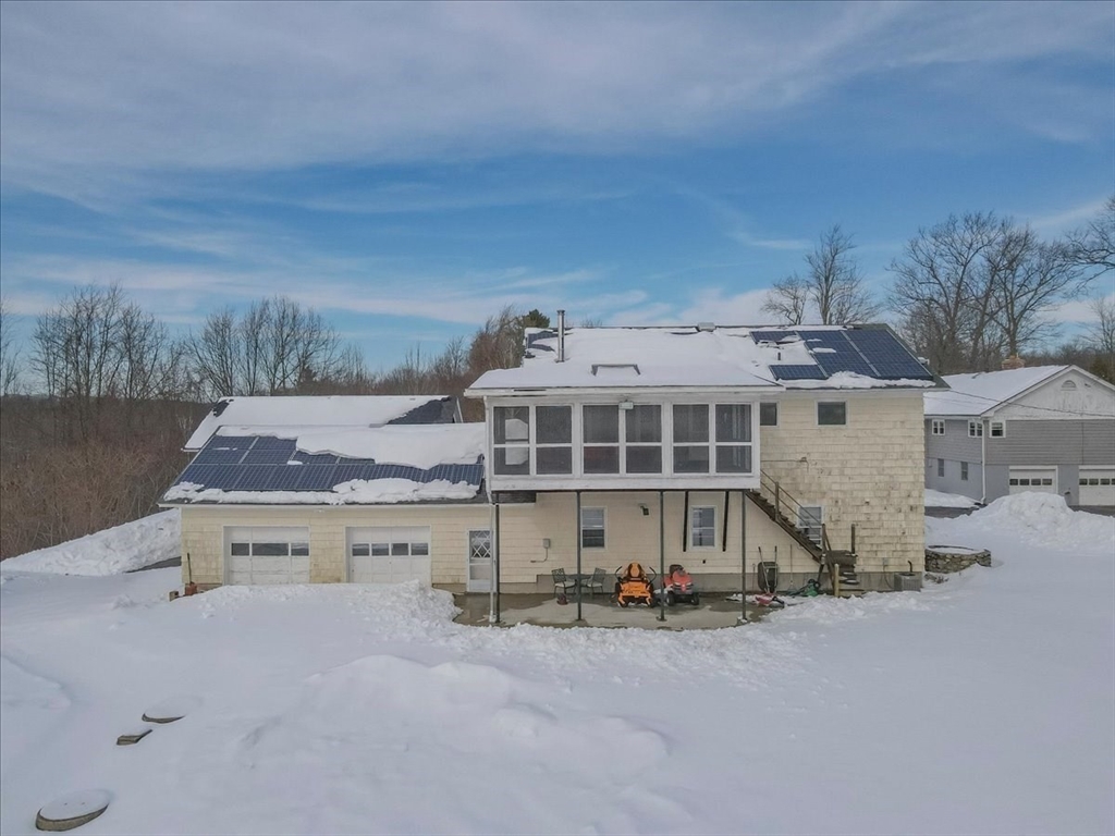 1083 Mt Elam Road Leominster, MA 01420 - Photo 23 of 30 an aerial view of a house with a yard and sitting area