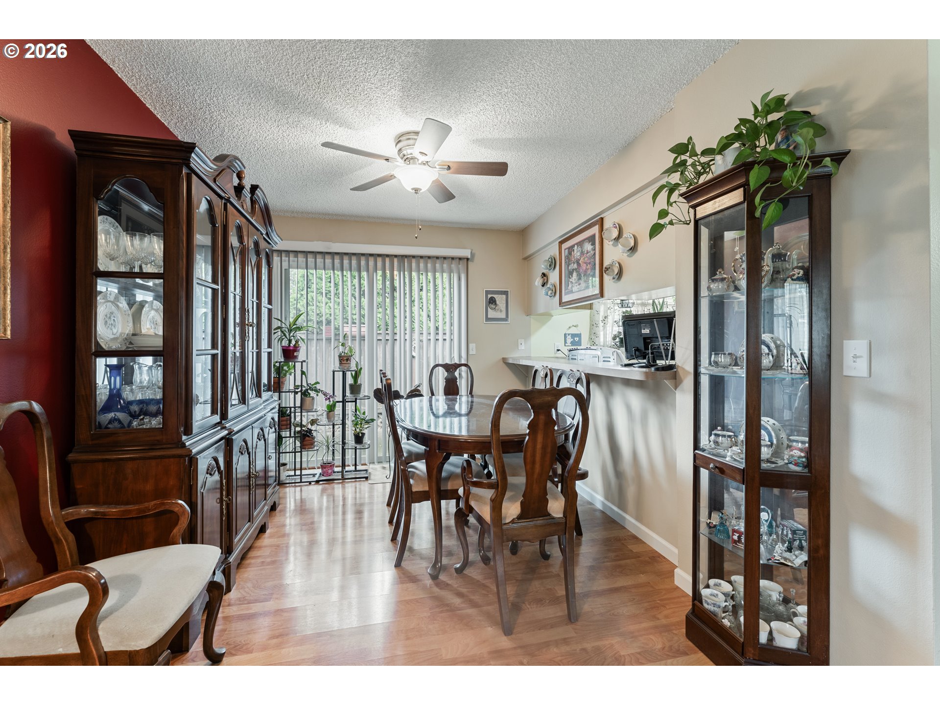 11341 Southwest Springwood Drive Portland, OR 97223 - Photo 10 of 26 a view of a dining room with furniture window and wooden floor