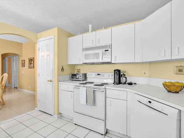 a living room with furniture a couch and a window