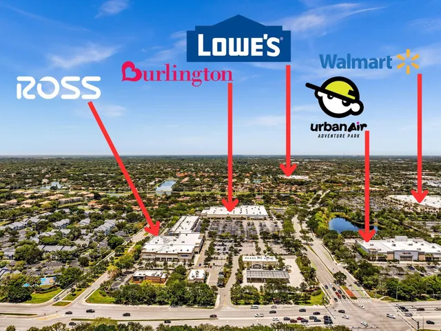 an aerial view of a house with a garden and lake view