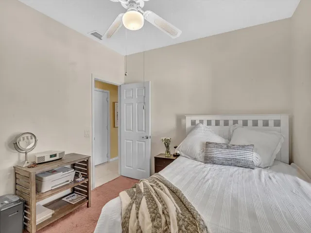 a garden with a bench and some trees