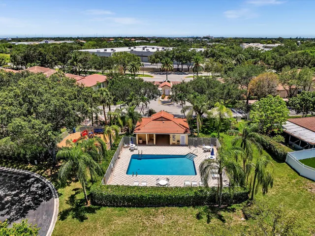 a view of backyard with seating and green space