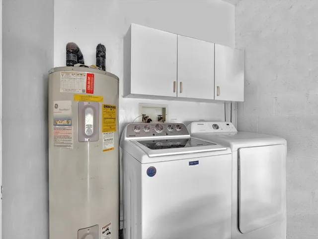 a view of a swimming pool with a table and chairs