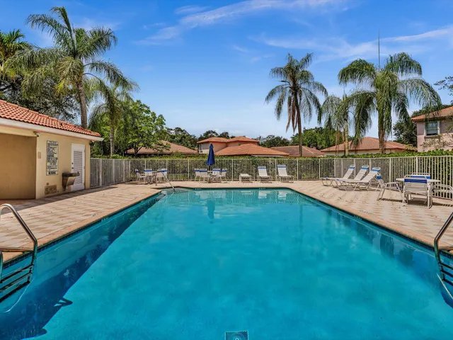 an aerial view of residential houses with outdoor space and river