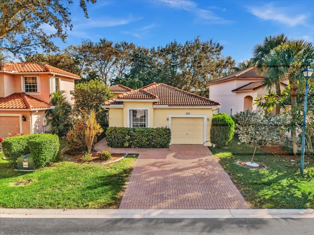a living room with furniture and a mirror