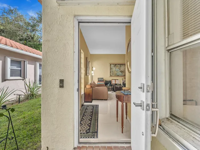 a living room with furniture a couch and wooden floor