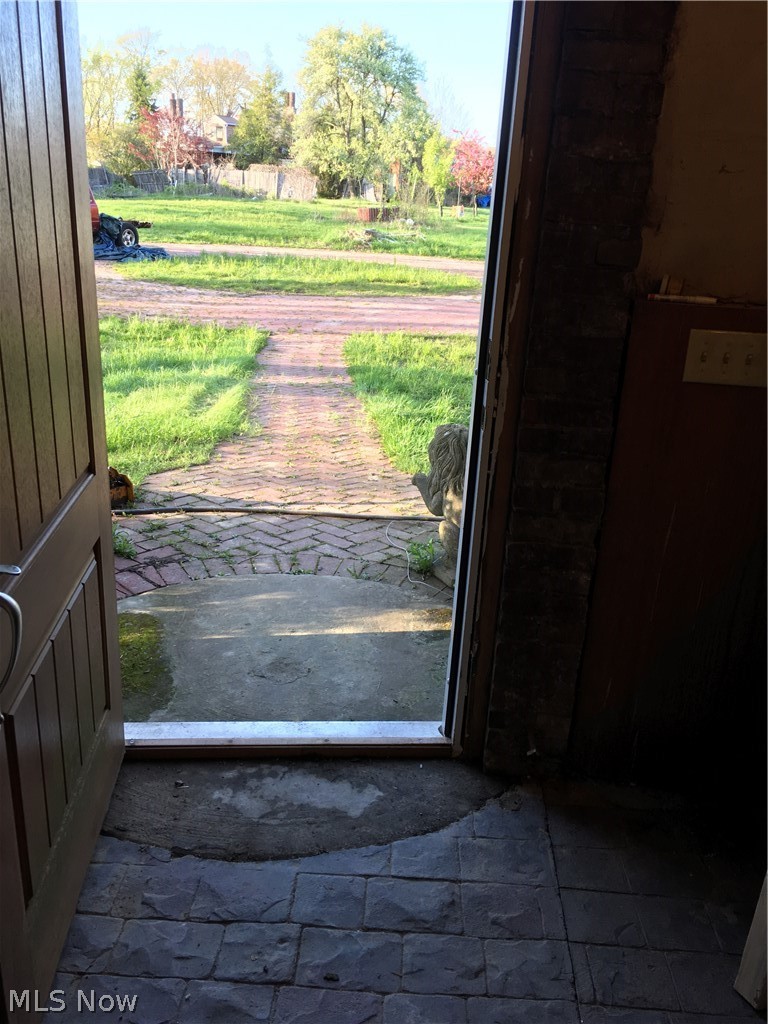 Front entrance. Herringbone brick walk and circular drive.