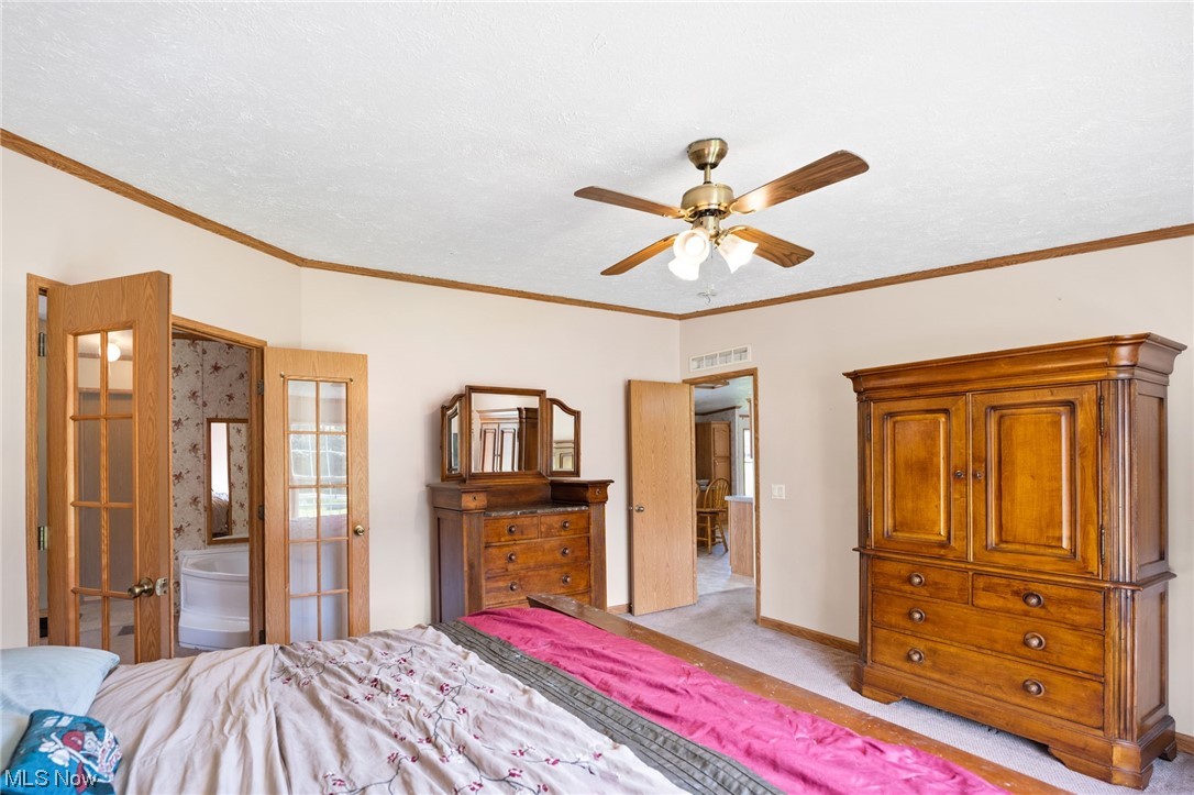 6268 Peck Road Ravenna, OH 44266 - Photo 14 of 25 Carpeted bedroom featuring crown molding and ceiling fan