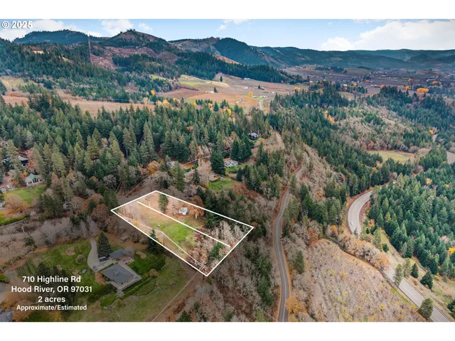 an aerial view of a house with mountain view