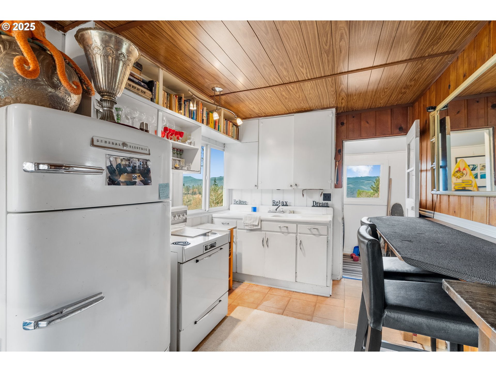 710 Highline Road Hood River, OR 97031 - Photo 13 of 36 a kitchen with refrigerator and cabinets