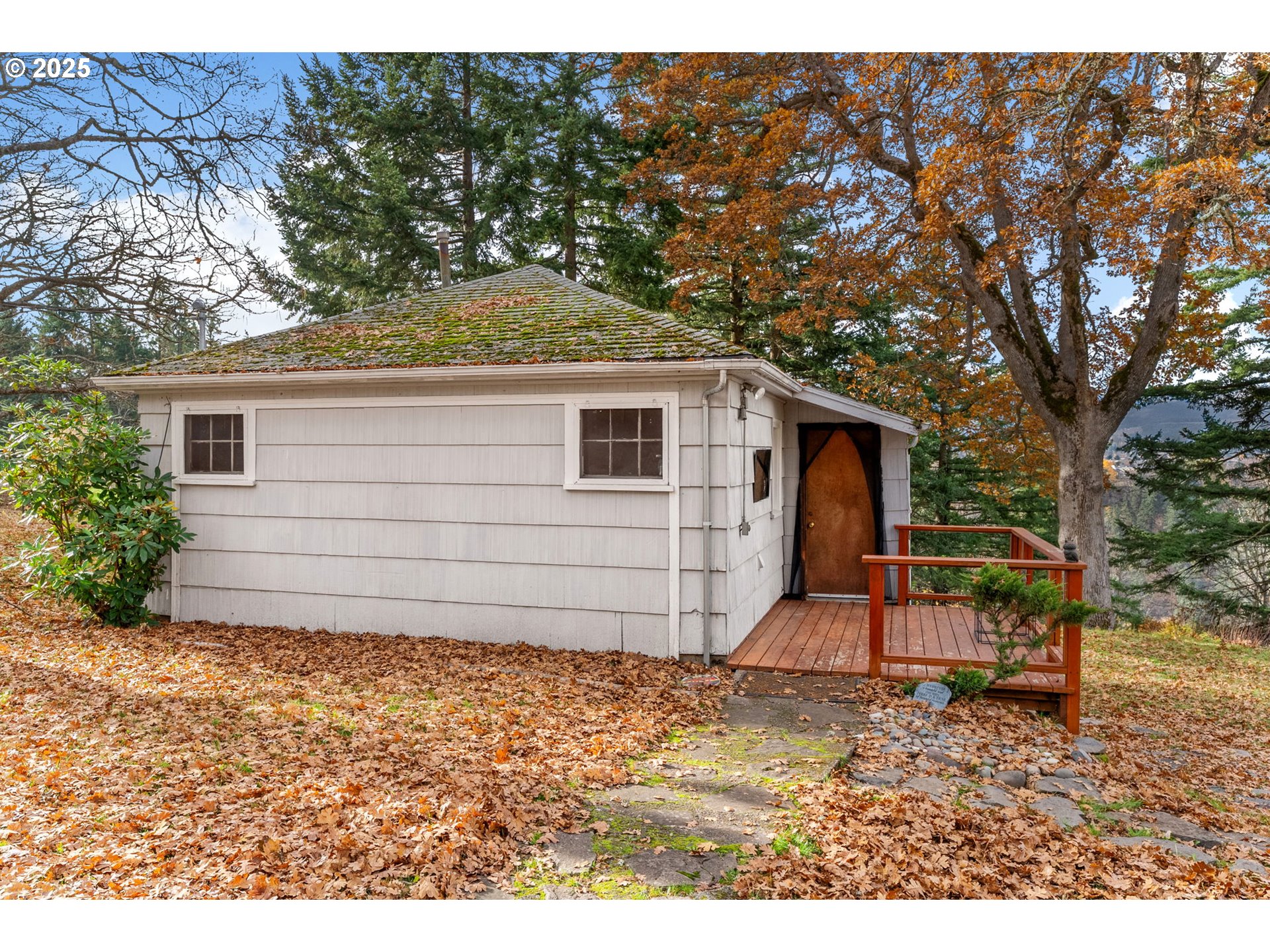 710 Highline Road Hood River, OR 97031 - Photo 9 of 36 a backyard of a house with barbeque oven table and chairs