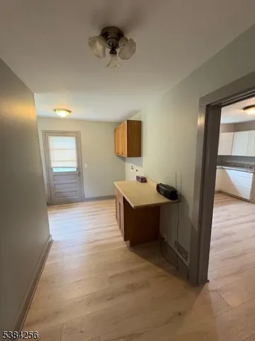 a spacious bathroom with a tub sink and mirror