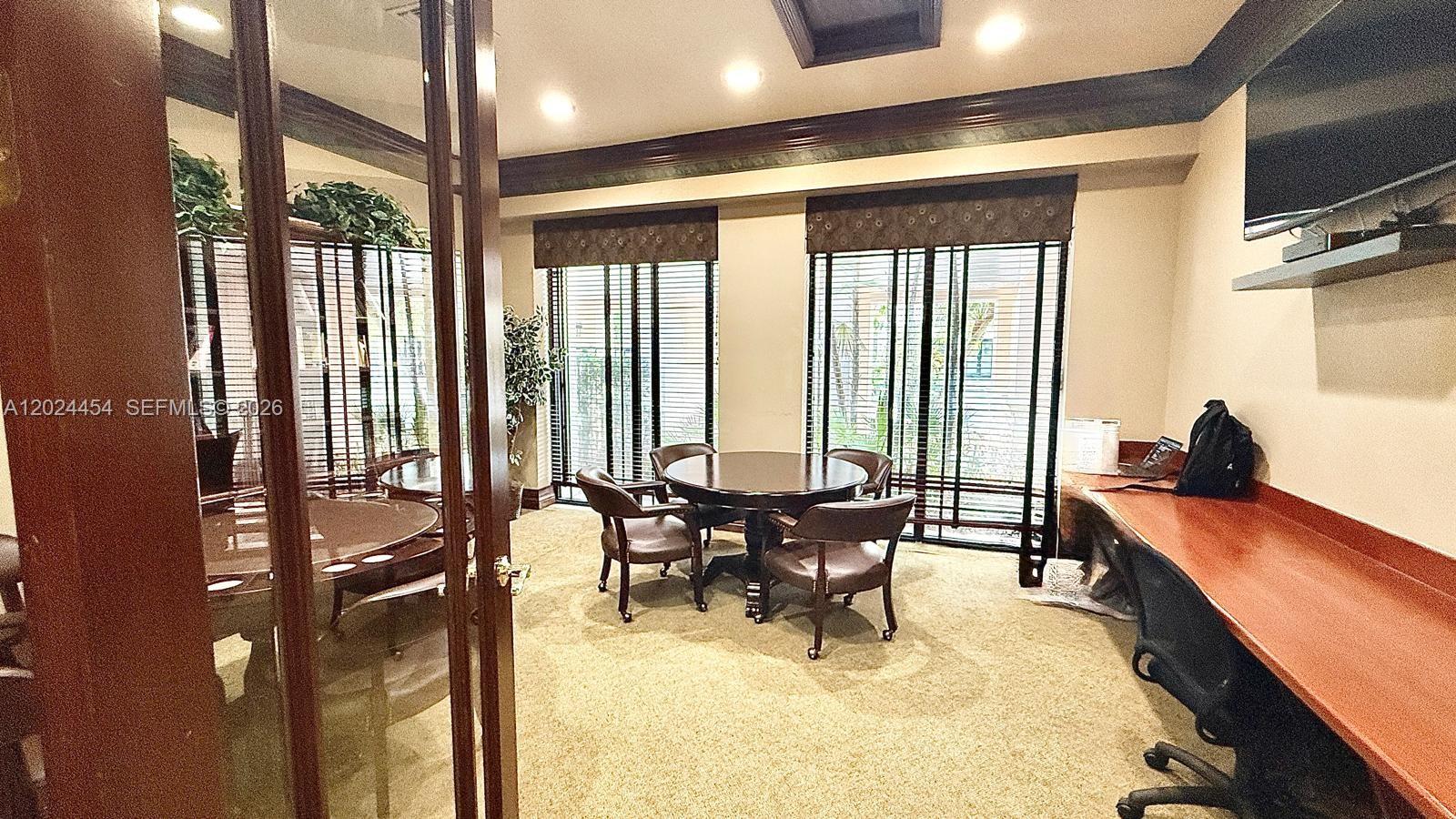 2727 Anzio Court, Unit 106 Palm Beach Gardens, FL 33410 - Photo 42 of 43 a room with lots of table and chairs