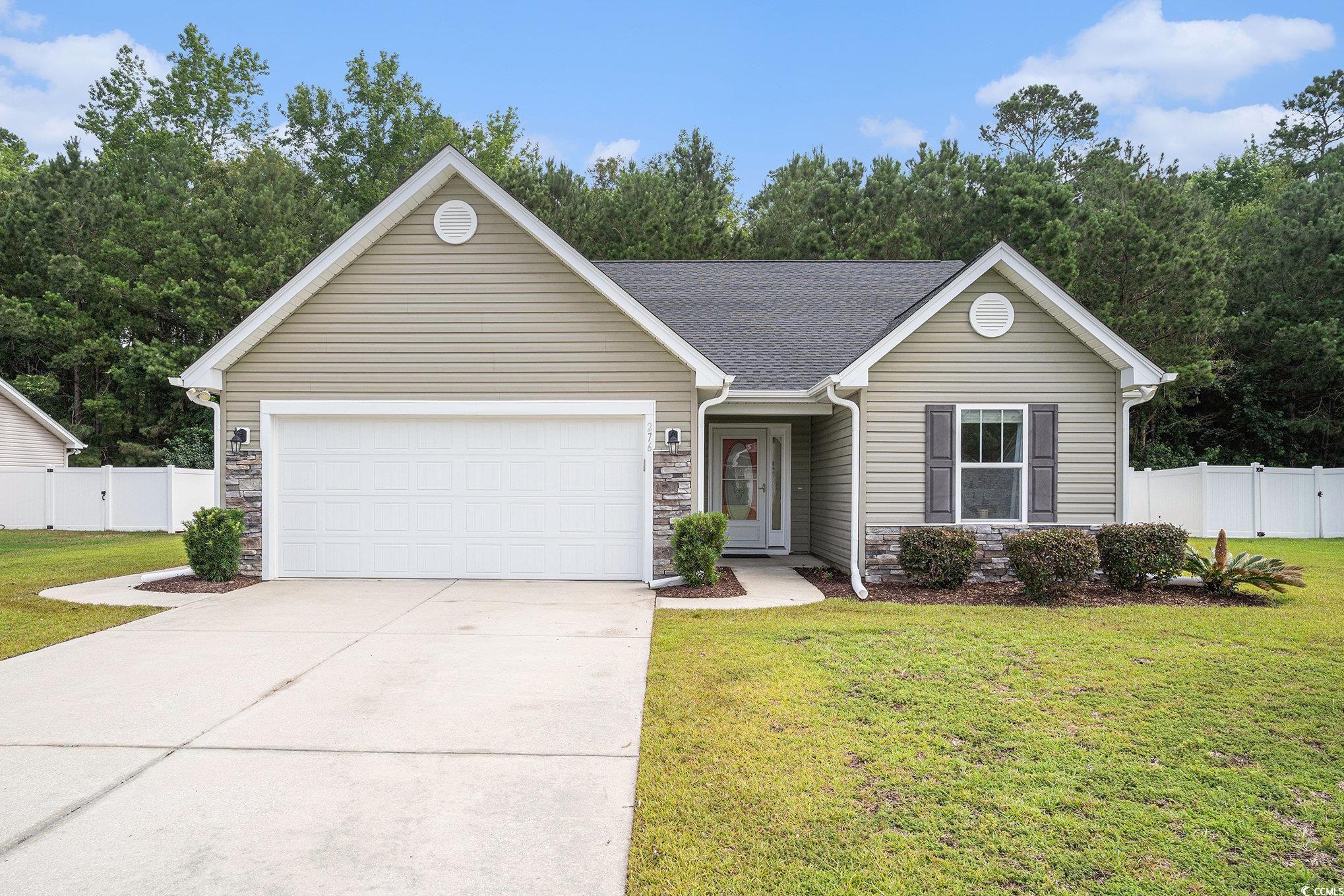 276 Avery Drive Myrtle Beach, SC 29588 - Photo 1 of 26 Ranch-style house featuring stone siding, driveway