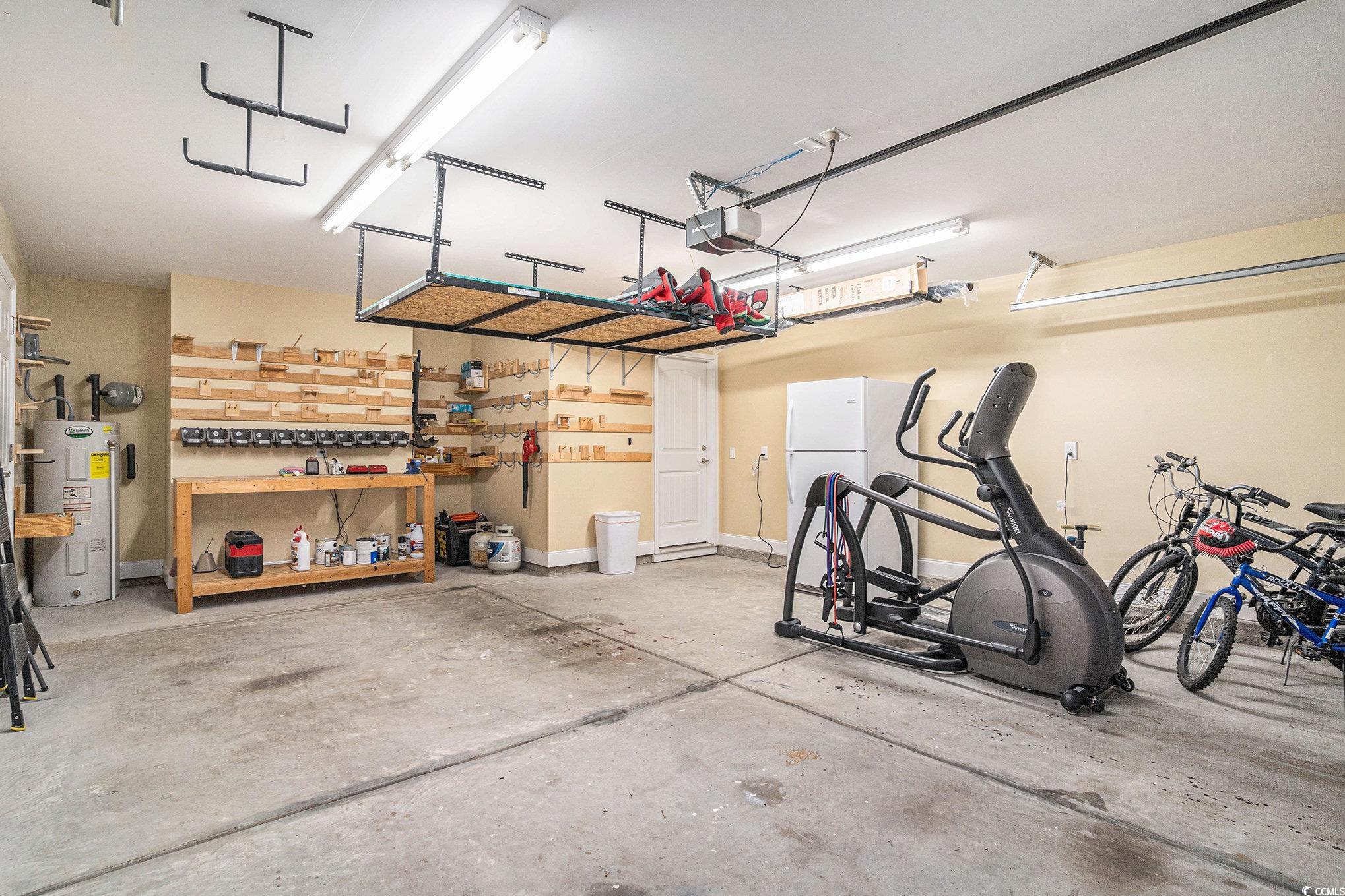 276 Avery Drive Myrtle Beach, SC 29588 - Photo 21 of 26 Garage featuring electric water heater, a garage d