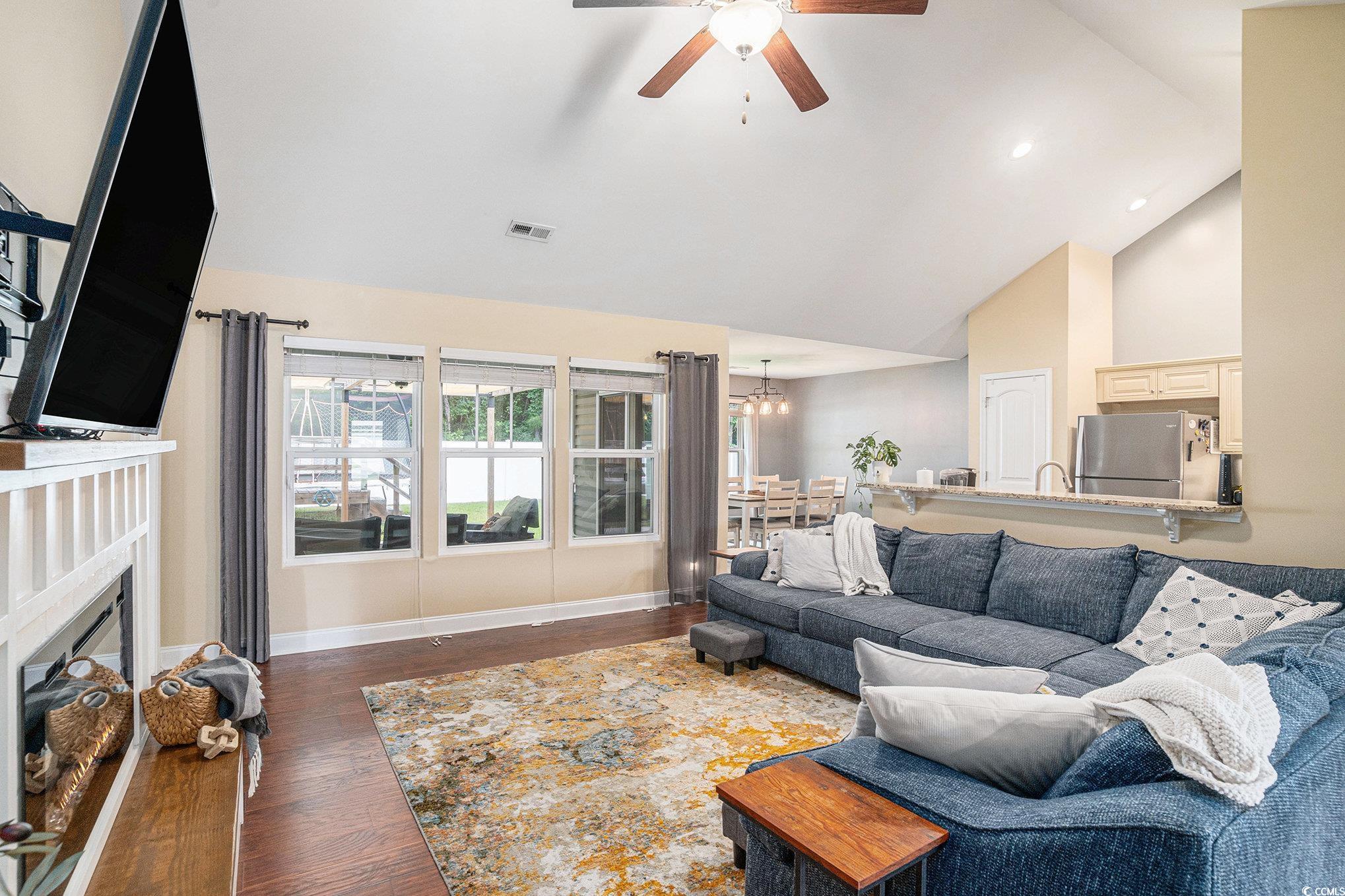 276 Avery Drive Myrtle Beach, SC 29588 - Photo 5 of 26 Living room featuring a ceiling fan, wood finished