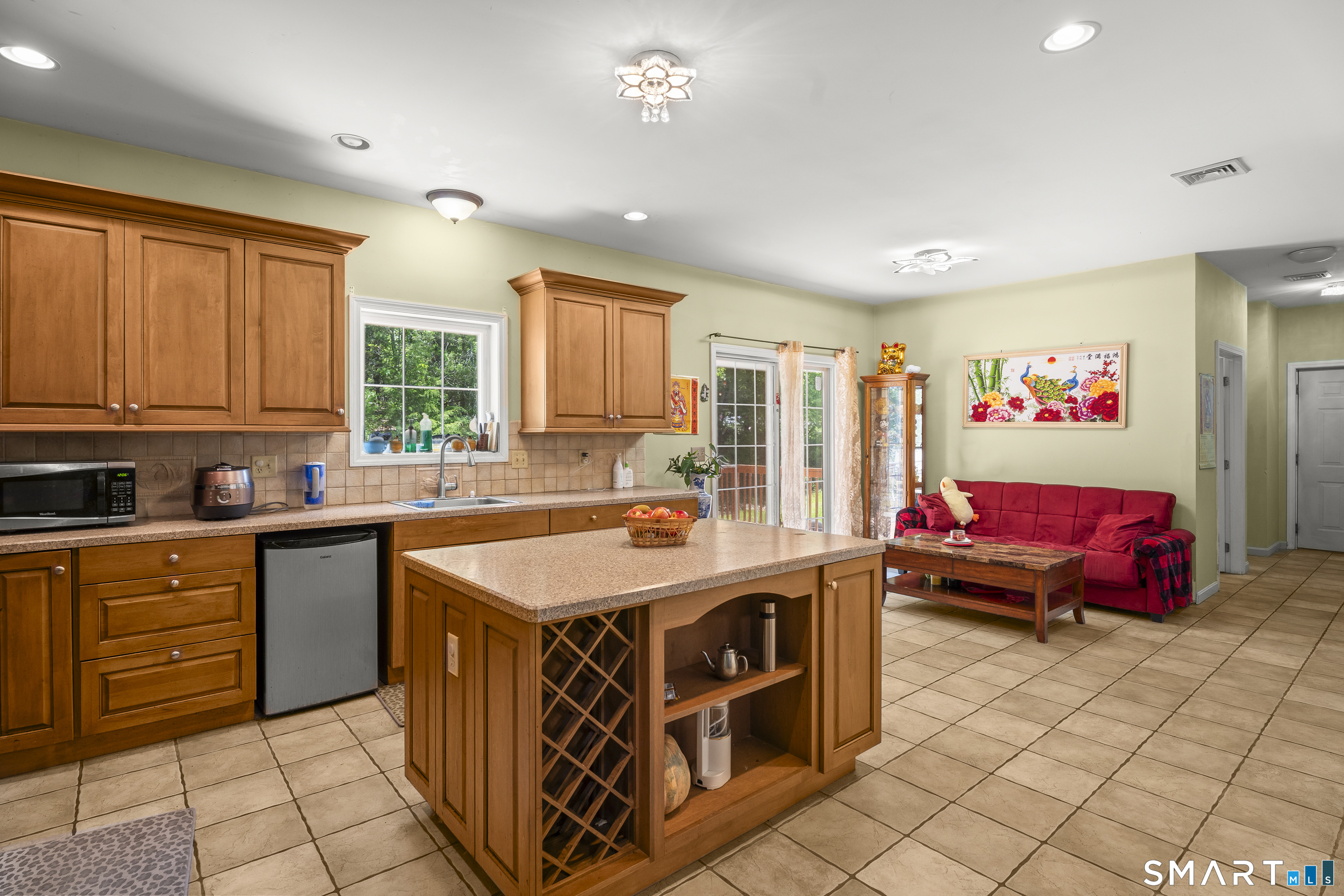 52 Middle Road Preston, CT 06365 - Photo 15 of 39 a kitchen with a stove a sink and a refrigerator