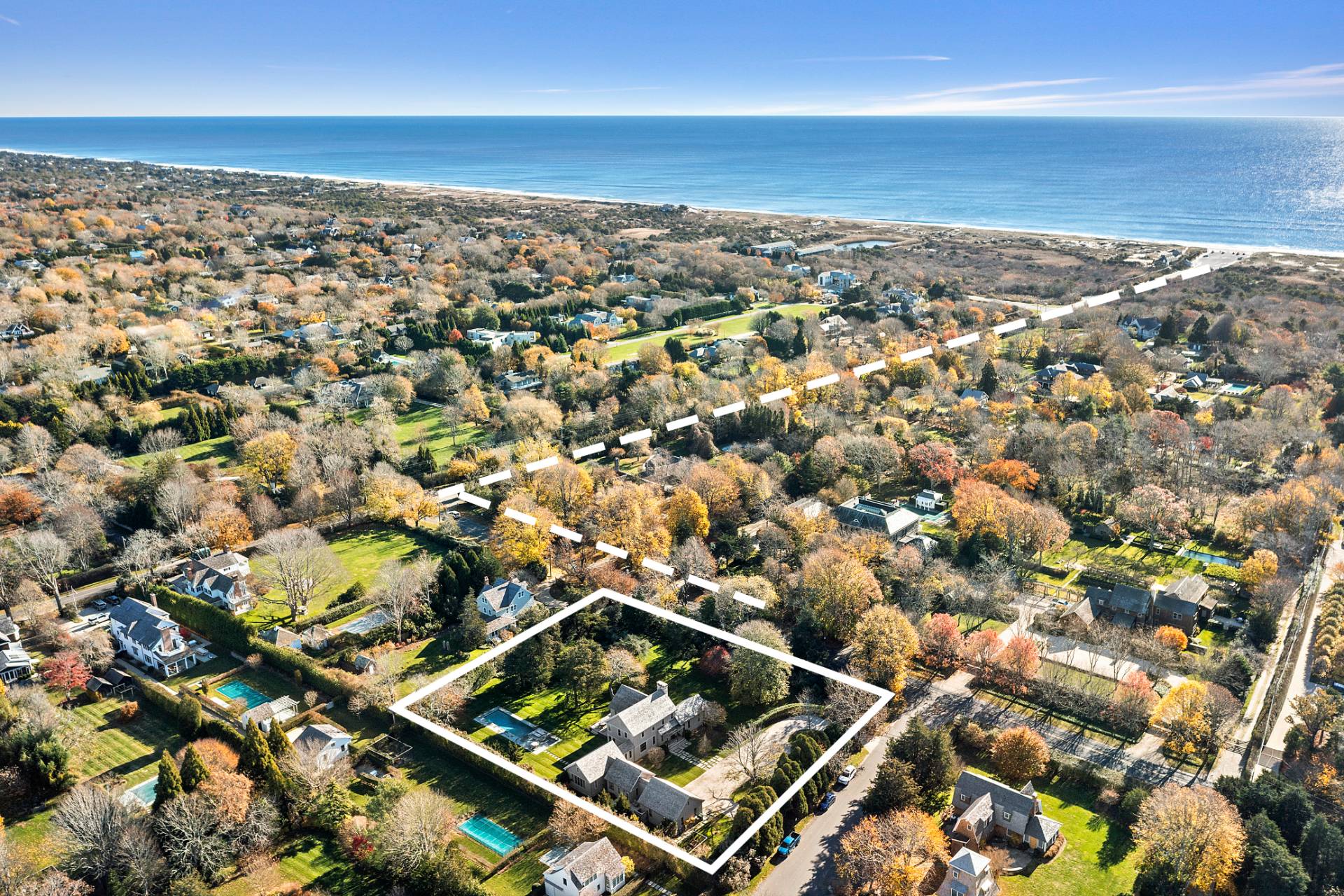 an aerial view of residential building with an ocean