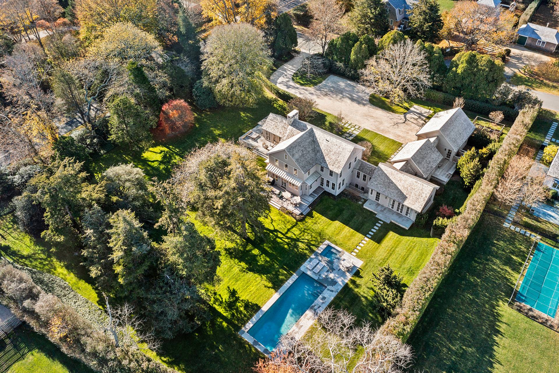 467 Further Lane Amagansett, NY 11930 - Photo 2 of 23 an aerial view of a house with a garden and swimming pool