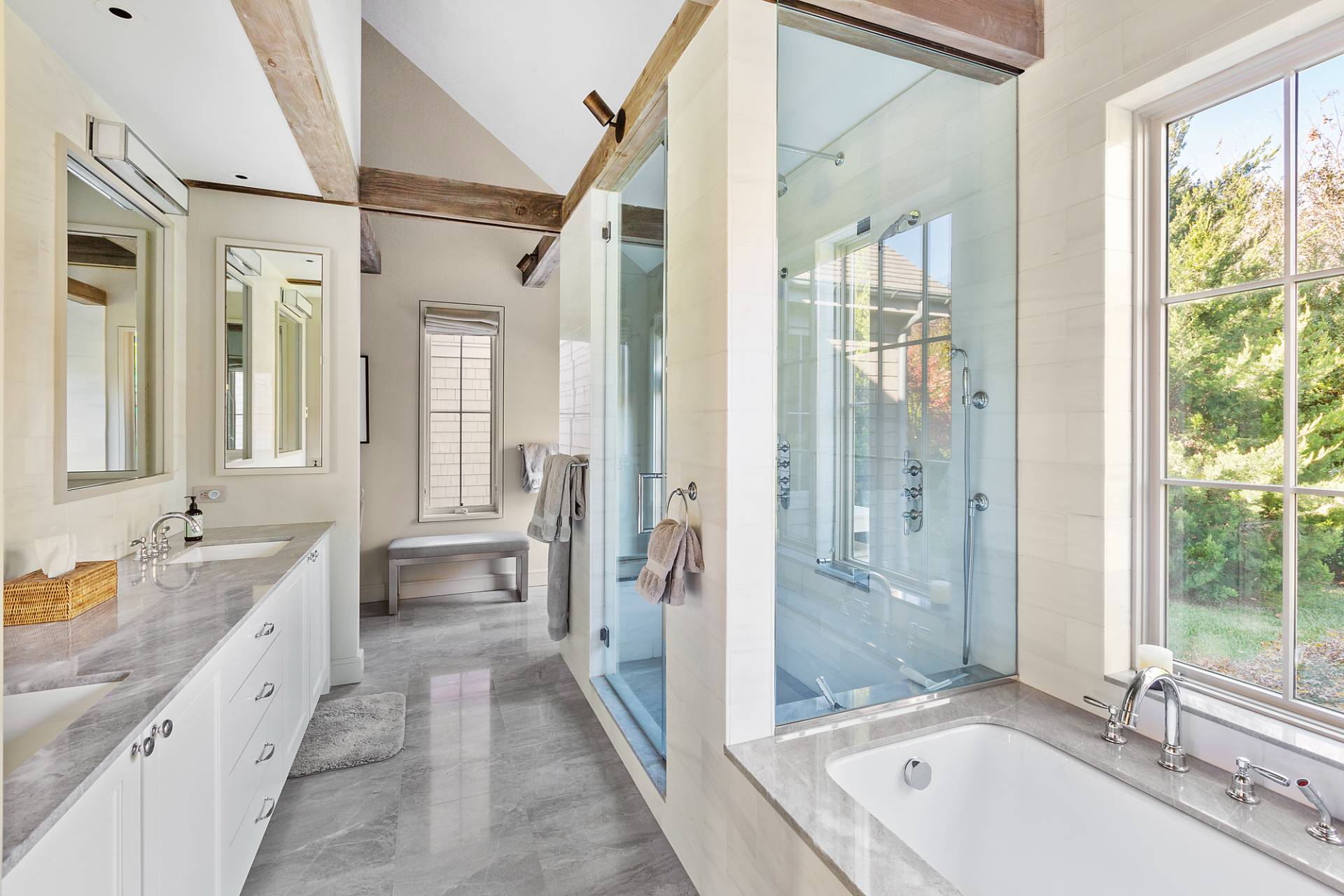467 Further Lane Amagansett, NY 11930 - Photo 15 of 23 a spacious bathroom with a granite countertop tub mirror and shower