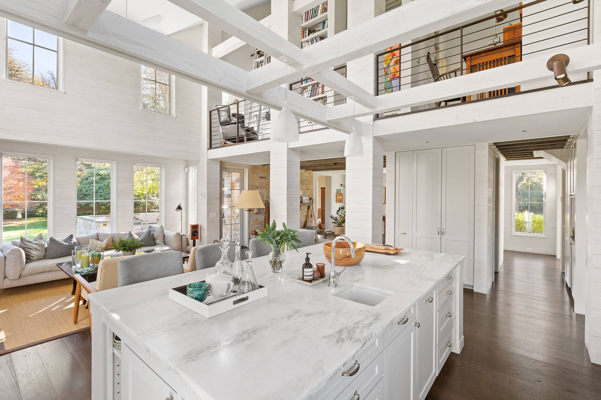 467 Further Lane Amagansett, NY 11930 - Photo 10 of 23 a view of a large kitchen with kitchen island a large window a sink and living room view